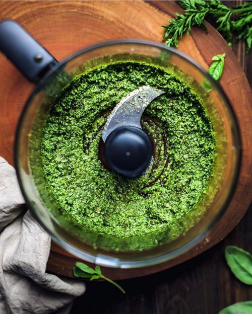 bledning ingredients for vegan pesto in a food processor